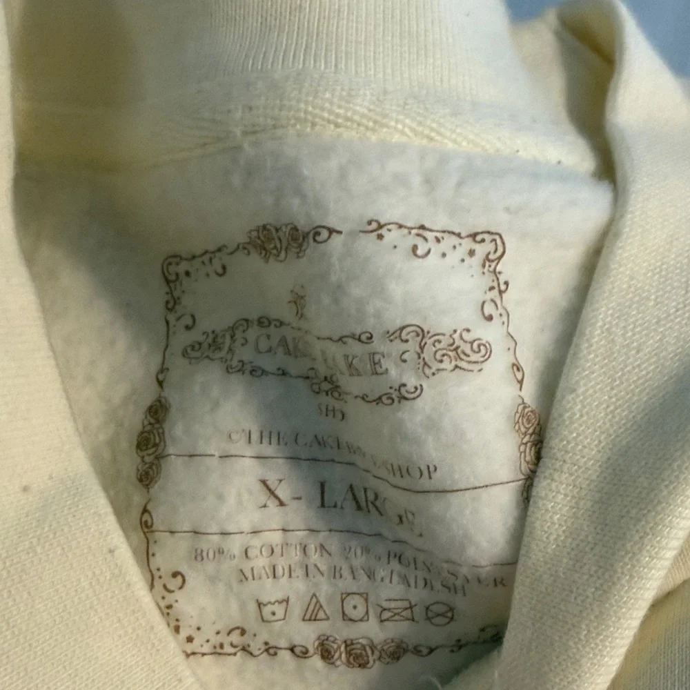 Cake Cream Yellow 'Cake-Bake Shop Rosé Bubbles' Graphic Sweatshirt - Picture 2 of 5